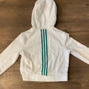 white and teal gripped adidas hoodie